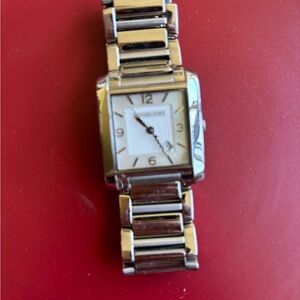 Silver Rectangular Watch with Metal Band Michael Kors

 great craftsmanship